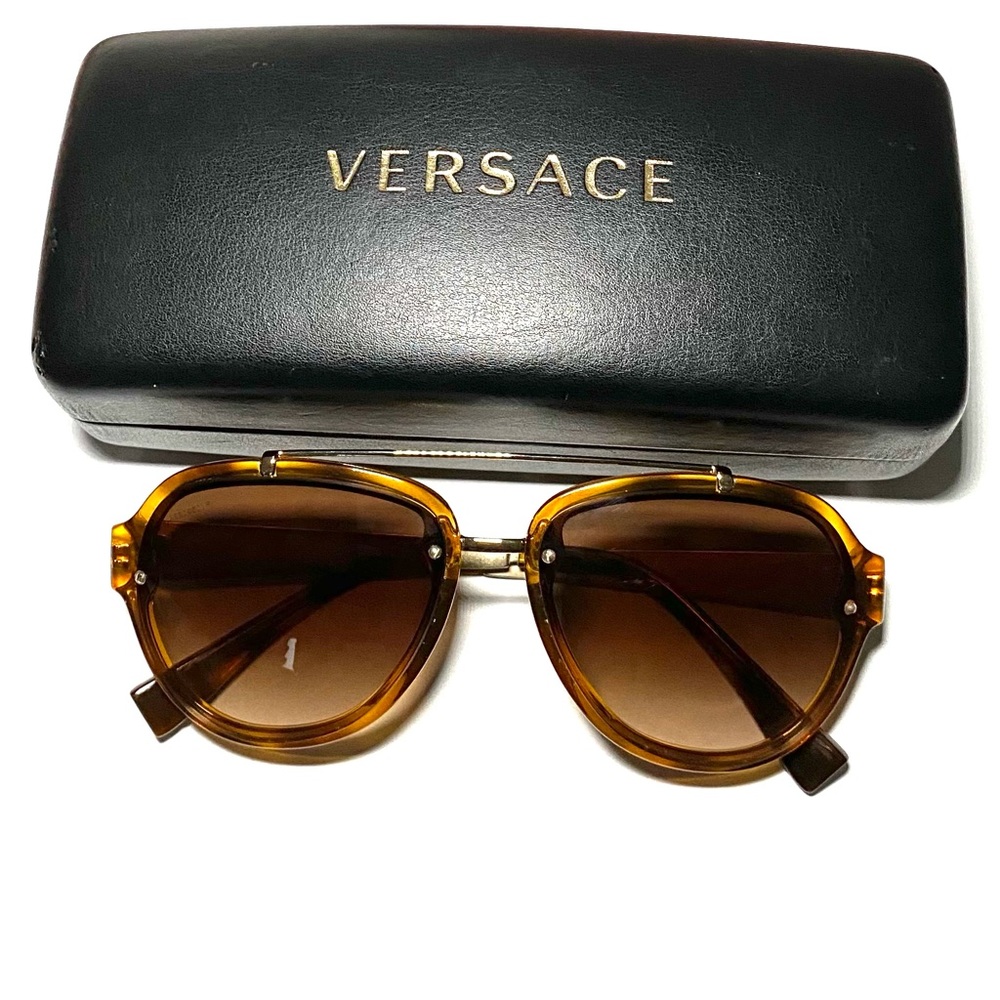 Versace acetate frame sunglasses.Brown in color w/gold rim. Absolutely beautiful